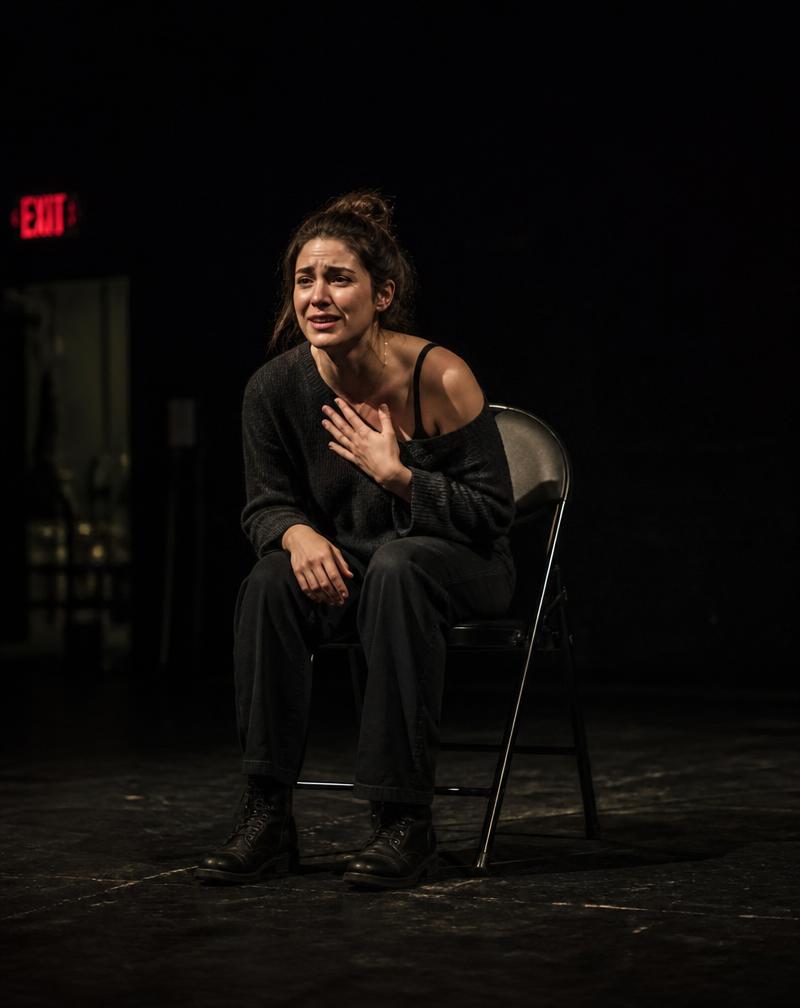 An actor performing during an audition on a bare stage